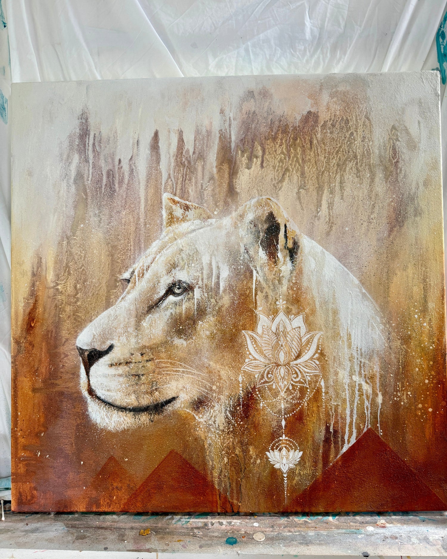 Artistic depiction of a lion's head with abstract patterns on a textured background