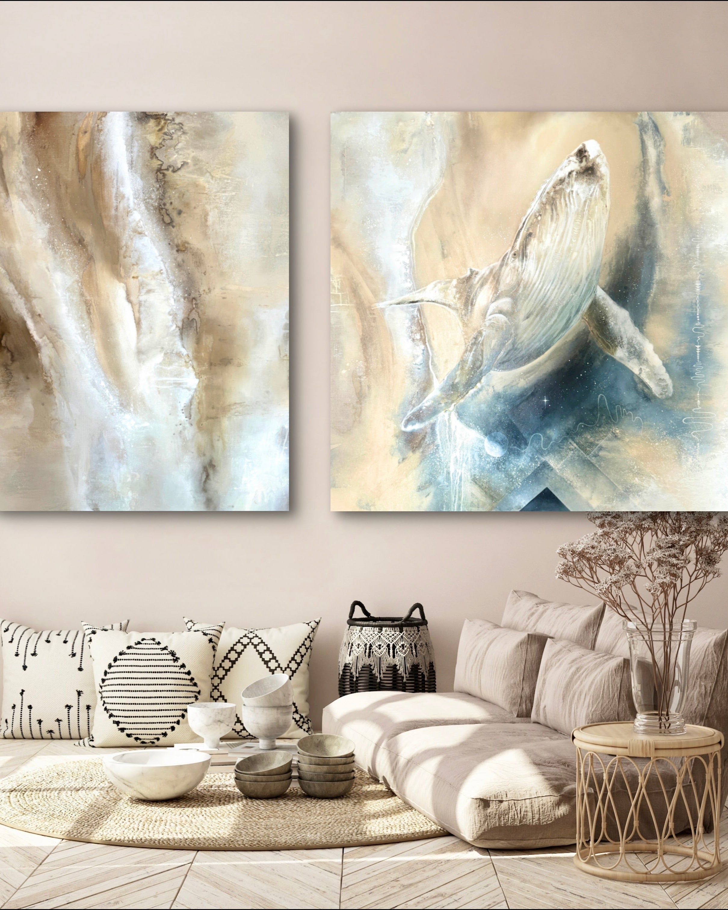 Two abstract art pieces on a wall above a living room setup.